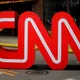 影/主播笑噴！學者上CNN直播突狂咳　尷尬認「蒼蠅飛進嘴裡」