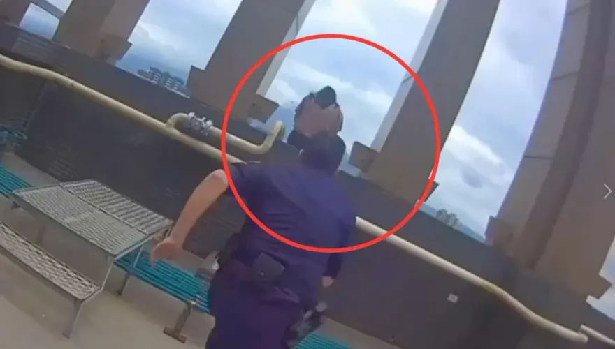 影/驚險！淡水女雙腳懸空跨坐24樓外牆　員警一個MOVE及時拉回救命