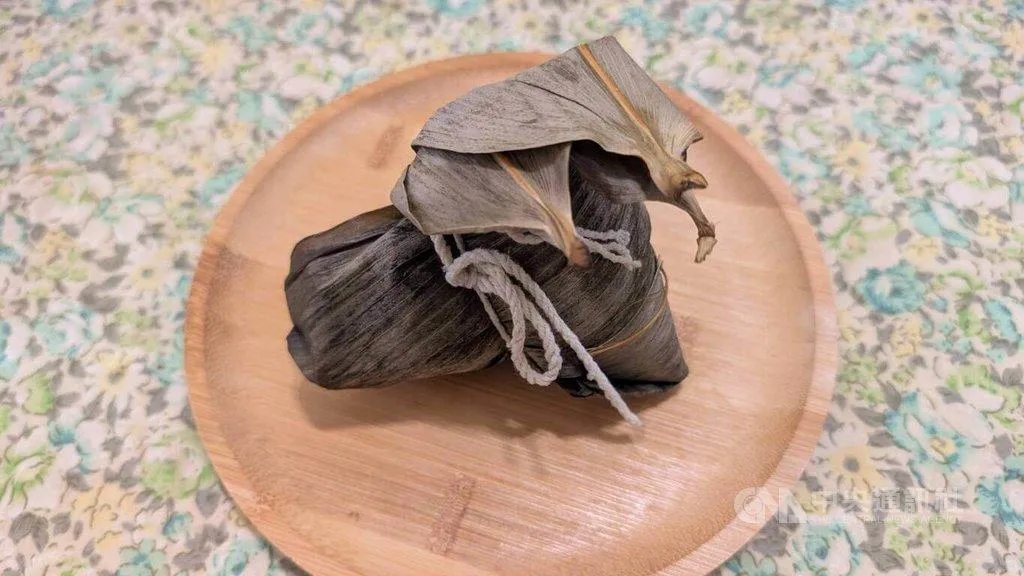 端午連假多吃幾顆粽子，小心脂肪「黏」在身上。（圖／中央社）