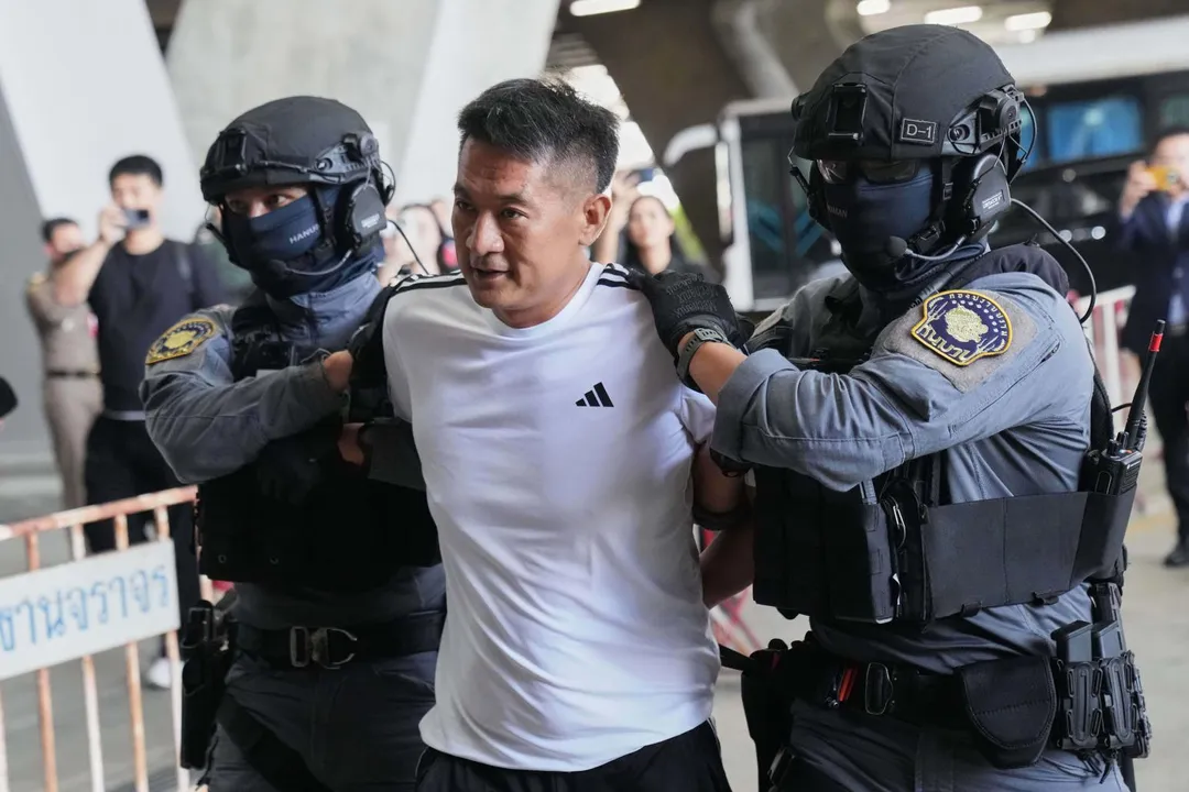 佘智江12日被泰國警方押送，將被引渡回中國大陸受審。 （圖/美聯社）