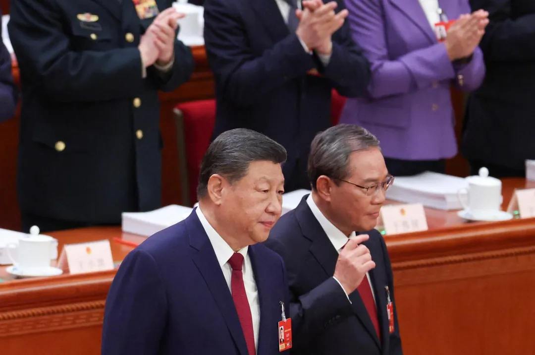 大陸國家主席習近平（左）與國務院總理李強（右）今出席人大開幕式。（圖／路透社）