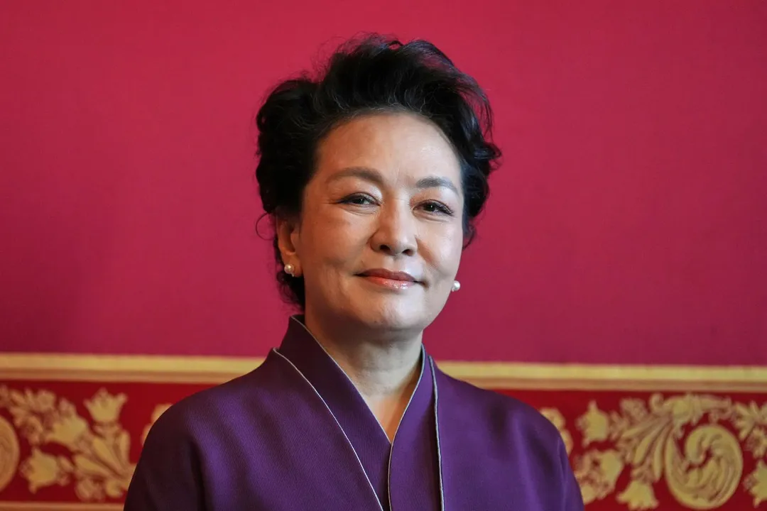 彭麗媛25日在白宮出席茶會。（圖／美聯社）